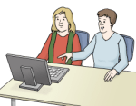 Zwei Personen sitzen vor einem Computer